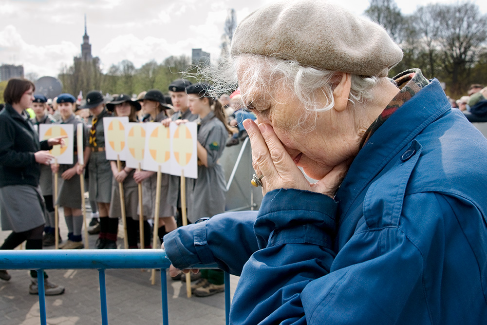 An old woman during the ceremony in a memory of crash victims. The Catholic mass.