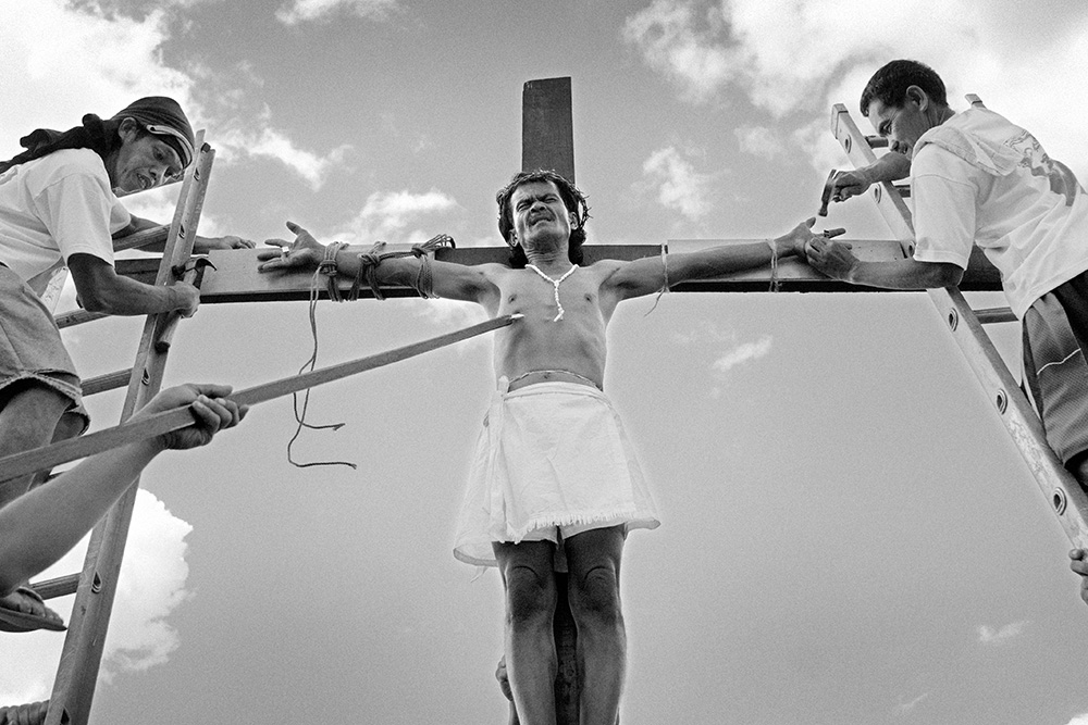 Good Friday. The crucifixion - a performed the act of Jesus Christ's death. The hands are nailed to a cross. This act usually follows the personal vows given to God and, in fact, is much more than just a performance.