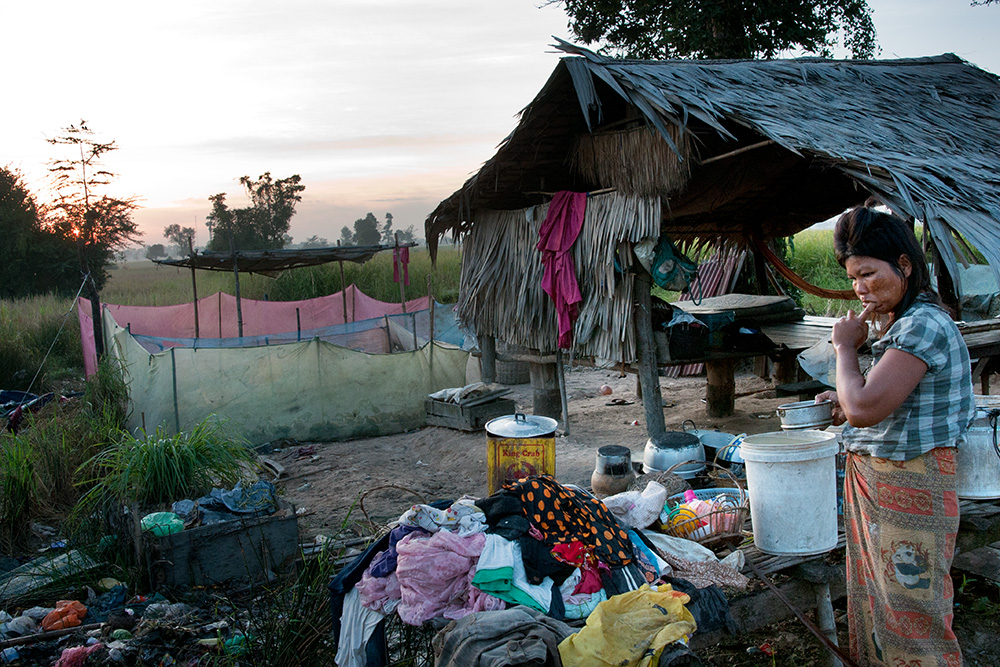 Poor settlements on a garbage dump in Siem Reap, early morning. People wake up and start another busy day on a dump.