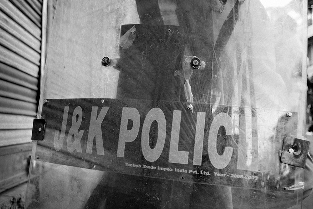 'Jammu & Kashmir Police' shield, streets of Srinagar during the riots.